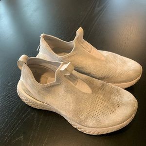 White Nike pull on tennis shoes.